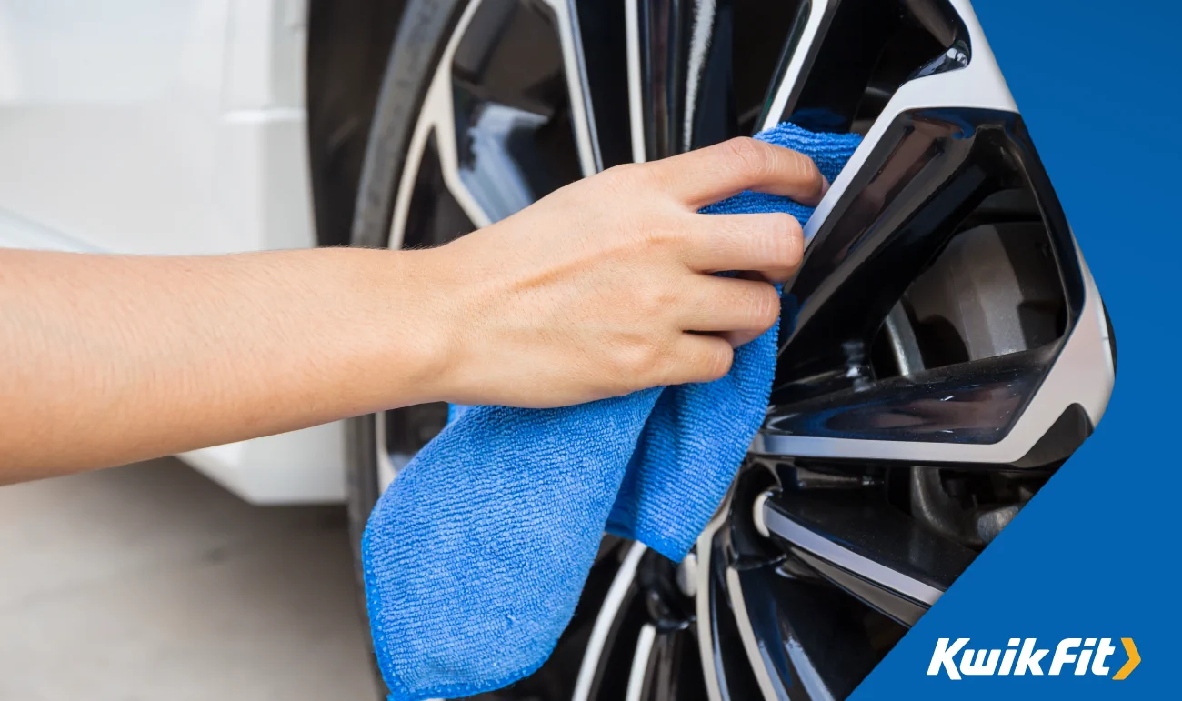 Using a microfiber to clean car wheels